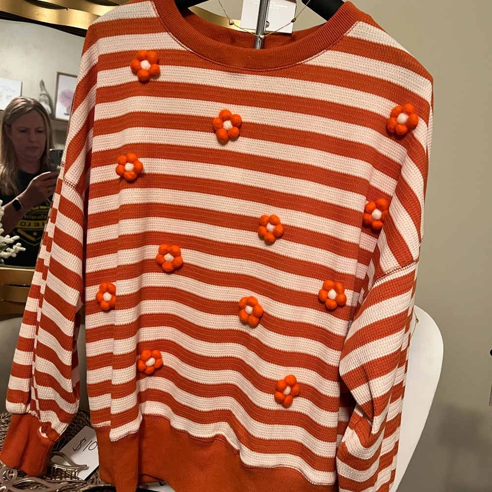 Orange and White Striped Sweater with Floral Accents